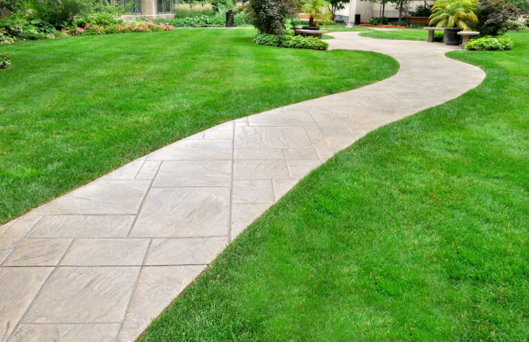 landscaping web design services page header image with paved walkway and lawn on for